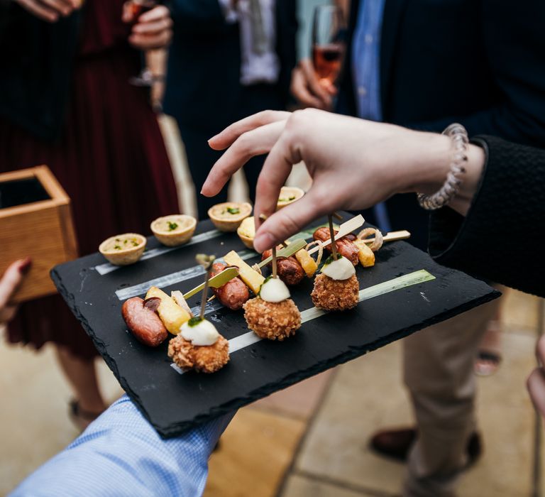 Hors d'oeuvres passed around on slate 