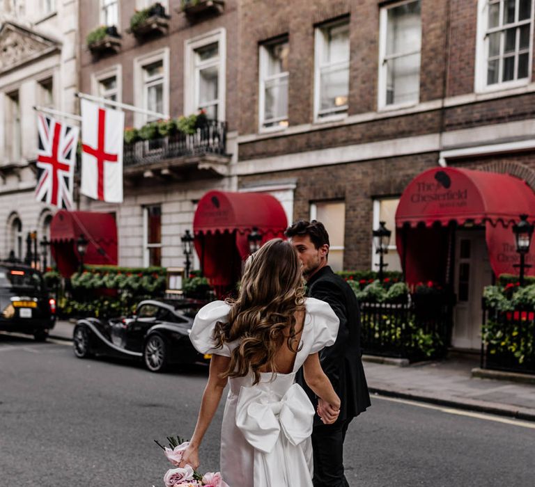 Short wedding dress with puff sleeve and long trailing wedding bow for London wedding 