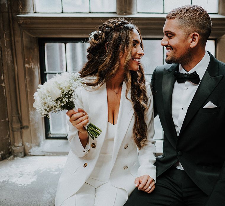 Bride and groom in black and white suits at intimate Sheffield registry office wedding 