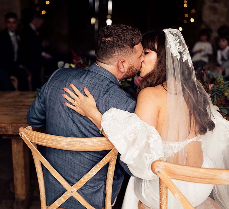 Bride & groom kiss on their wedding day 