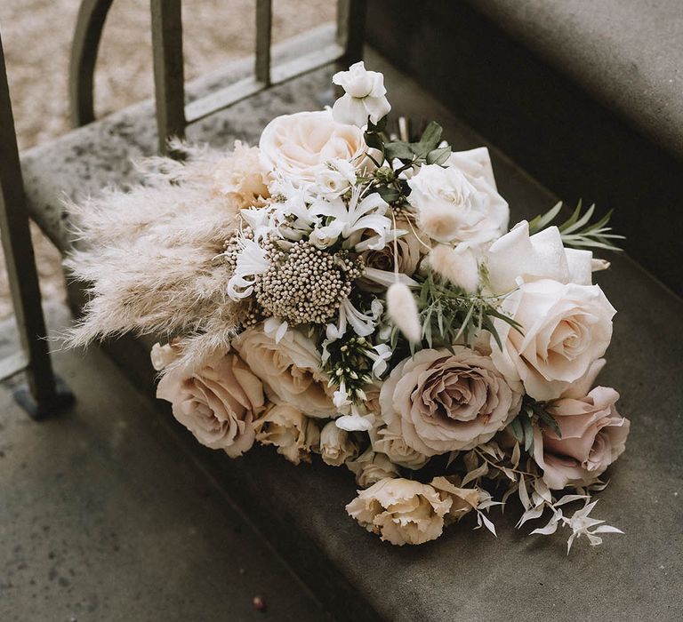 Beautiful neutral and blush wedding bouquet with pampas grass