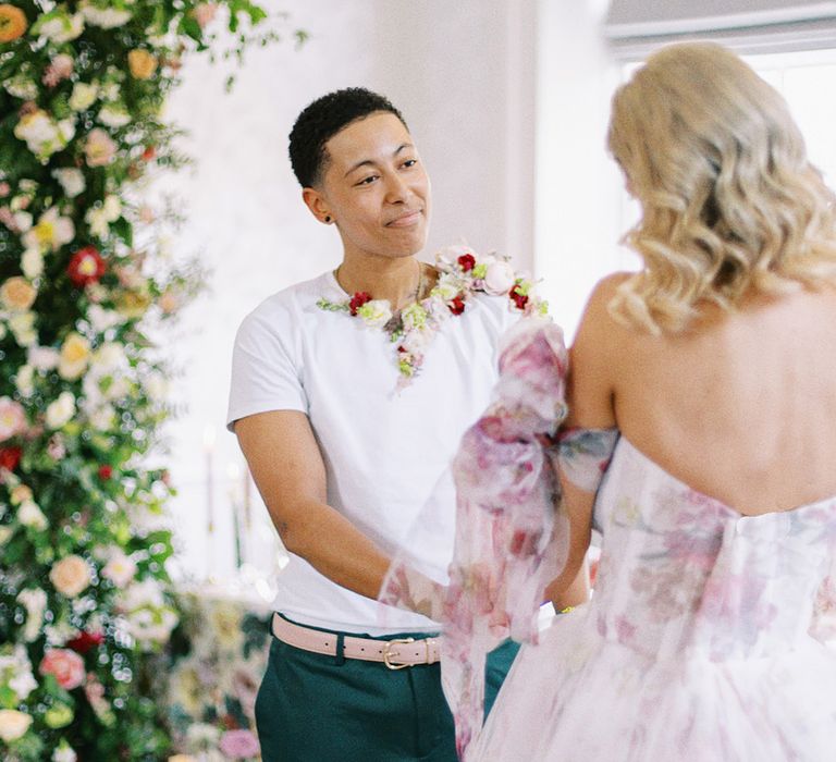 LGBTQI+ couple holding hands at their Barnett Hill Hotel wedding ceremony 