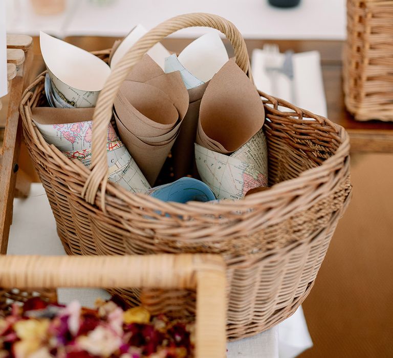 Paper cones in wicker basket ready for dried petal confetti 