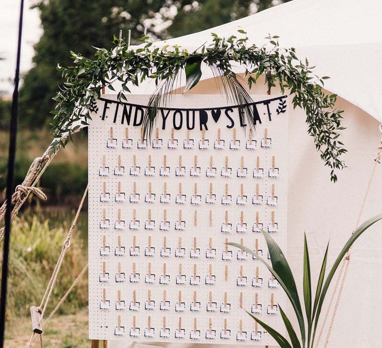 White peg board wedding seating chart idea