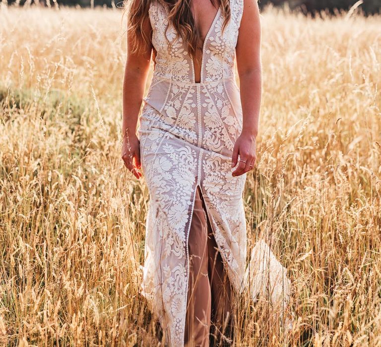 Sleeveless plunging boho wedding dress with a front slit 