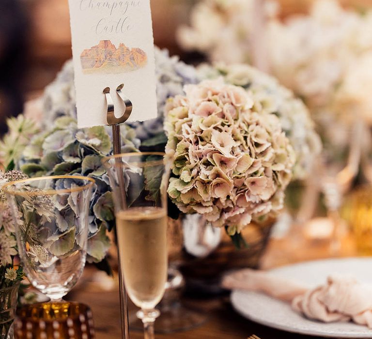 Floral arrangements of hydrangea for simple table setting with the tables named after mountain ranges in South Africa