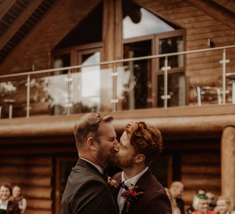 Grooms share their first kiss as a married couple 