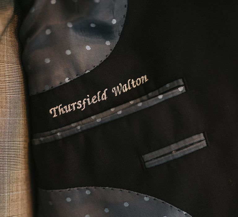 Embroidered suit with the couples' new joint last name from Edit Suit Co