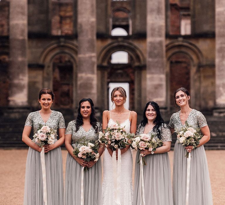 Sequin short sleeve grey bridesmaid dresses with the bride in a lace wedding dress for a Hanley Hall Worcestershire wedding 