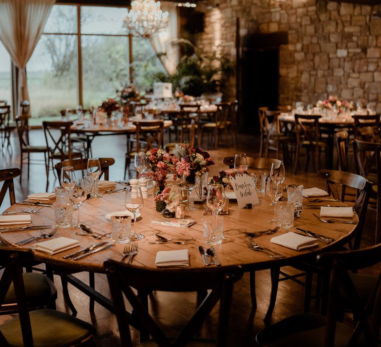 Rustic and simple round wedding tables for boho Newton Hall wedding in Northumberland 