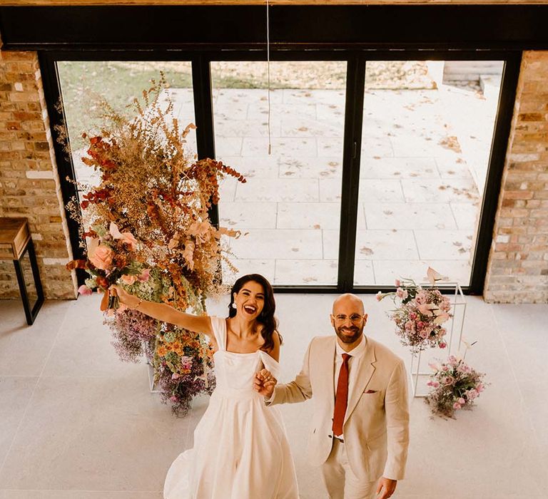 Chapel House Estate wedding venue in Kent with orange column wedding flowers