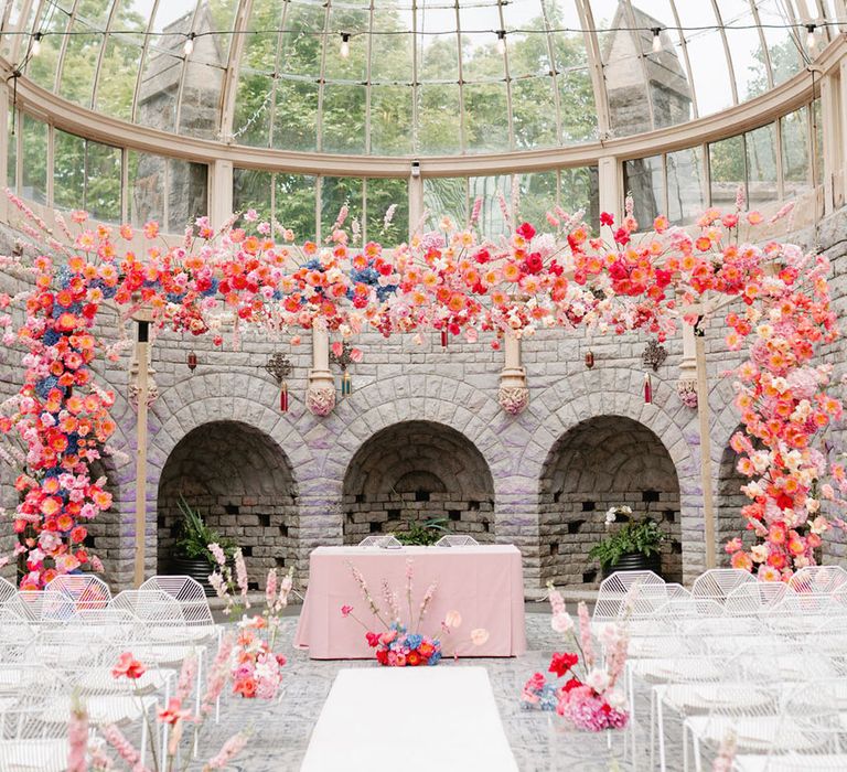 De Vere Tortworth Court wedding venue glass house wedding venue with bright pink wedding flowers for Moroccan theme wedding 