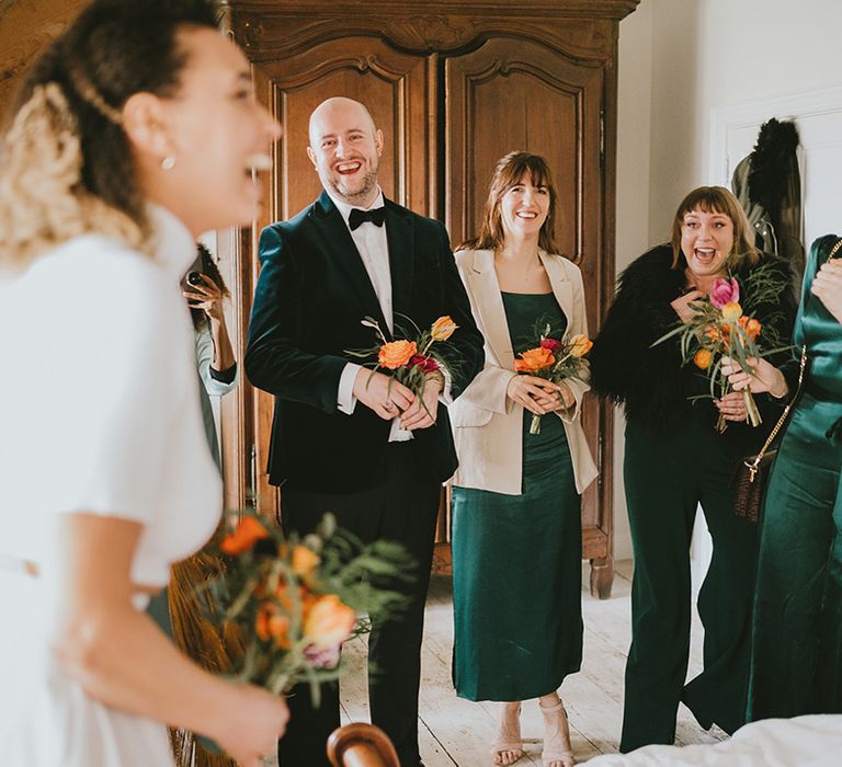 Green theme wedding outfits for the bridal party at botanical glasshouse wedding venue 