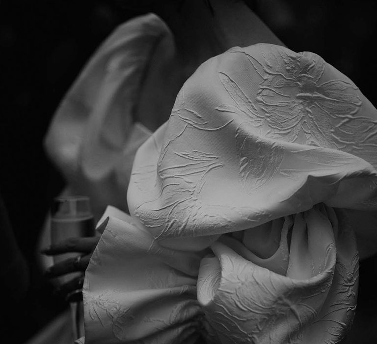 Close up of the brocade detailing on the Jesus Peiro wedding dress 