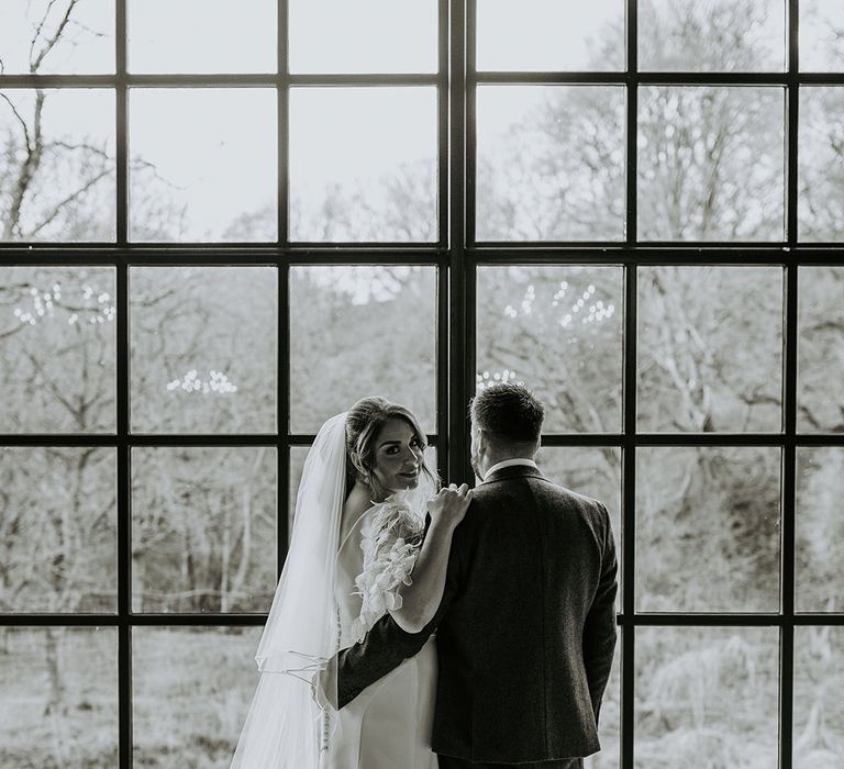 Black and white wedding photo of the bride and groom at their romantic wedding 