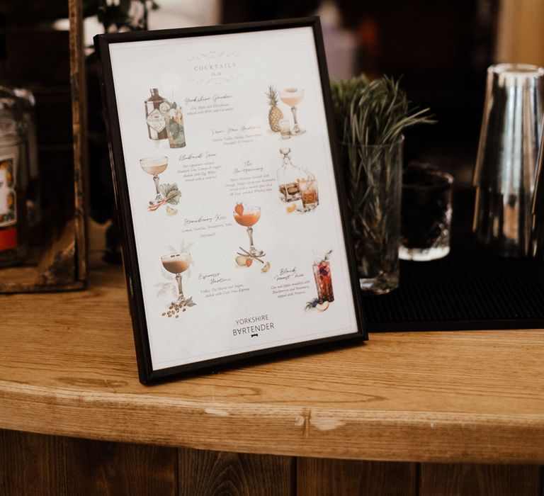 Painted wedding cocktail menu at the bar for guests 