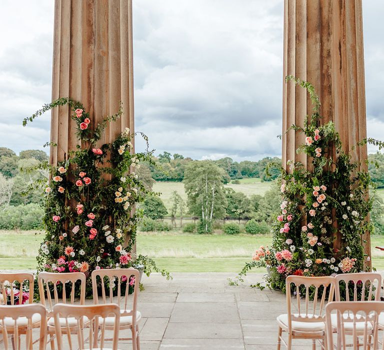 The Grange Hampshire wedding with romantic outdoor wedding ceremony decorated with pink wedding flowers 