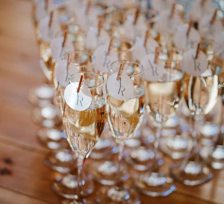 Personalised glasses of champagne with the wedding logo 