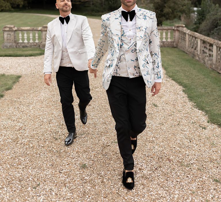 Two grooms in black tie wedding fashion at luxe country house wedding 