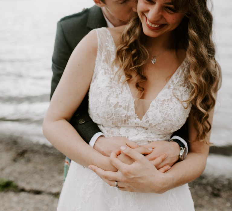 Groom embraces bride in Perthshire, Scotland