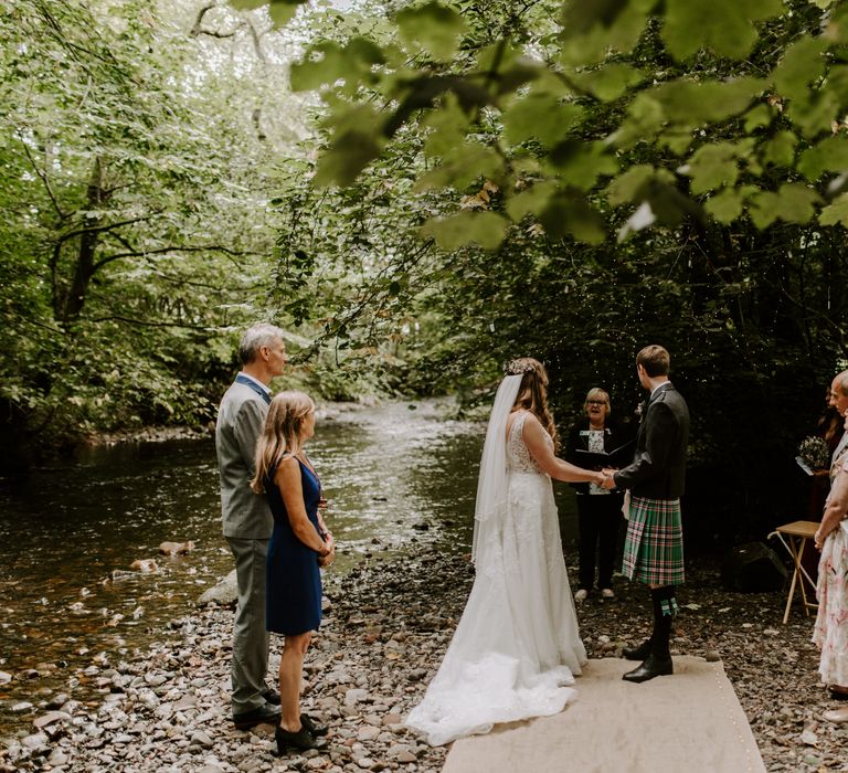 Intimate wedding elopement in the forest of the Scottish Highlands with fairy lights