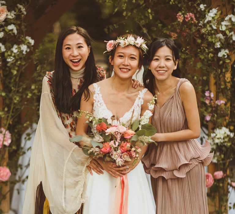 Bridal party portrait with bridesmaids in different dresses 