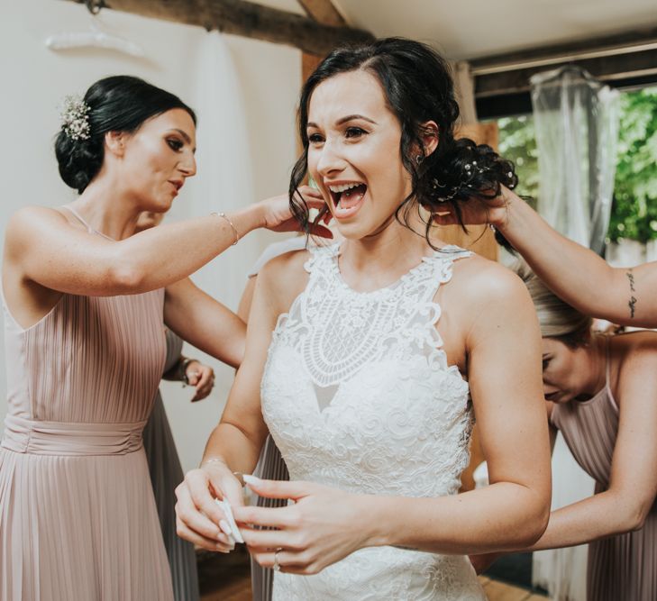 Bride gets ready with her bridesmaids in Christina Wu dress