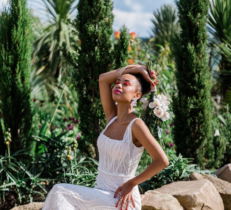 Bride in Forrest by Rachel Rose Bridal dress sat in botanical garden at Urban Jungle Suffolk