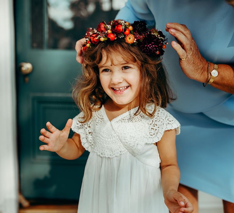 Flower girl wearing Autumnal coloured flower crown