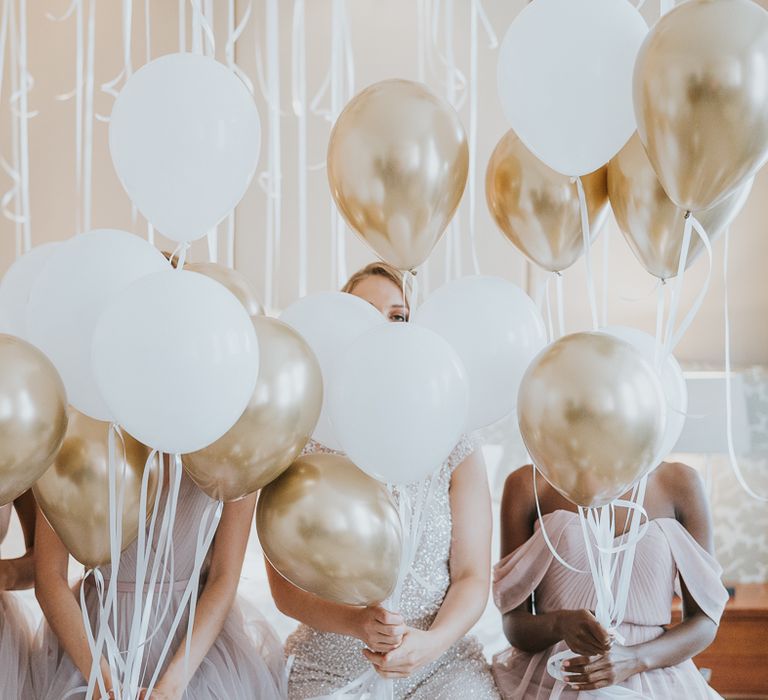 Metallic gold and white biodegradable helium balloons 