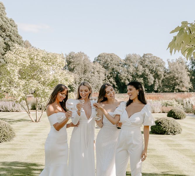 All white bridesmaid outfits with jumpsuits, midi and maxi dresses 