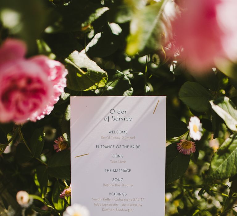 Wedding stationery Order Of Service in green foliage