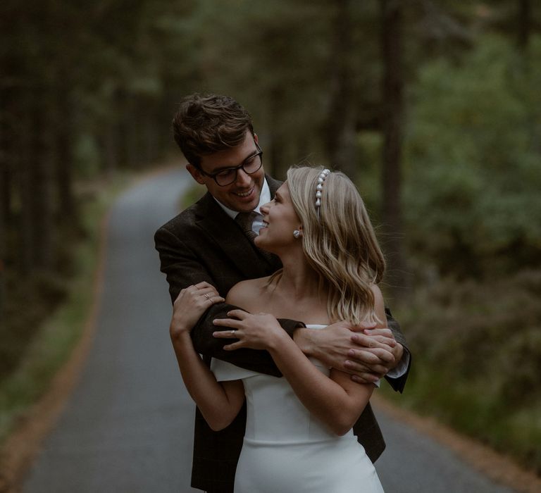 Bride & groom embrace on wedding day