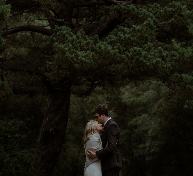 Bride & groom embrace outdoors during Scottish elopement