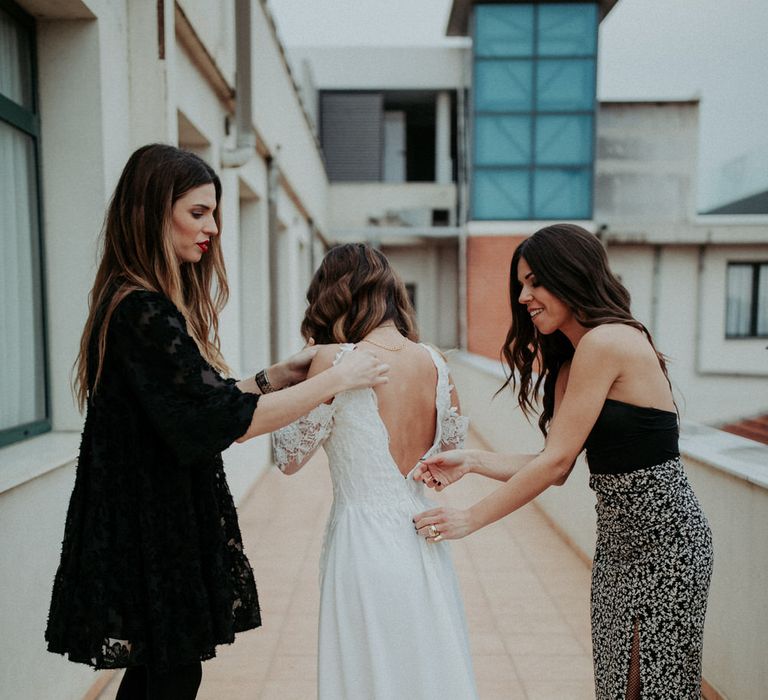 The bride getting ready in a Nadia Rapti gown