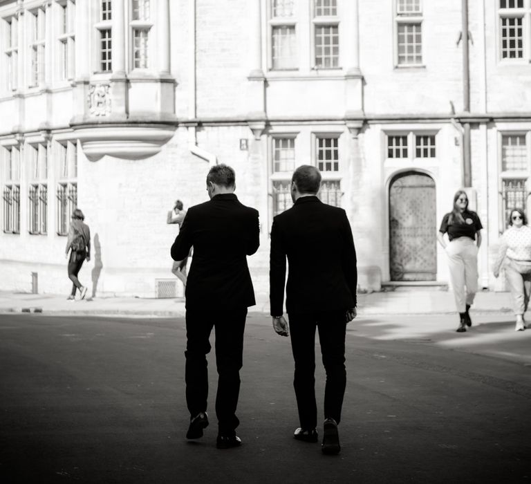 Grooms walk through Oxford in black & white image