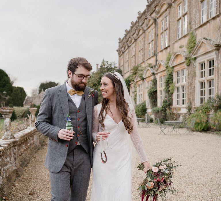 Bride and groom outside Brympton House on their wedding day