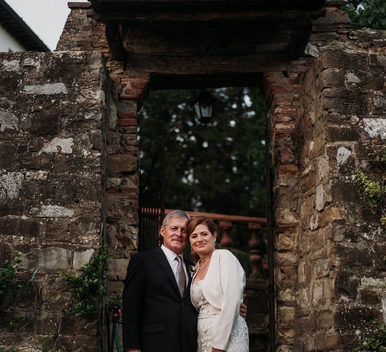 Bride & groom stand together for intimate Italian wedding outdoors