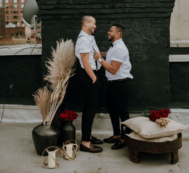 Pampas grass and red rose decor at intimate elopement