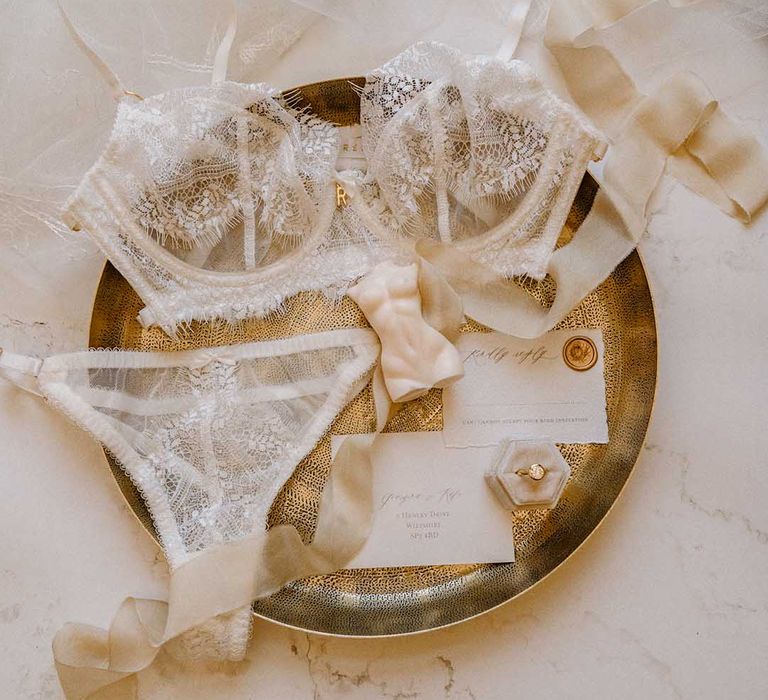 Lace lingerie set by Roisin Reuss on a gold platter 