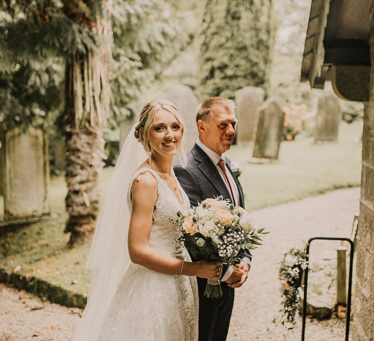 Bride waits to enter church wedding ceremony