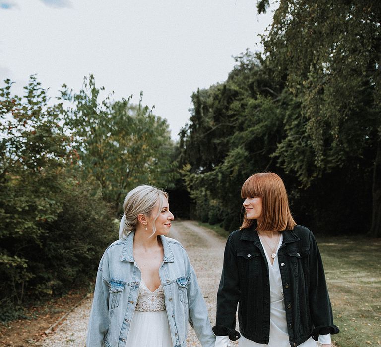 Personalised denim jackets for brides at lesbian wedding