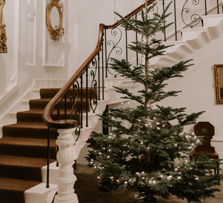 Trelowarren House complete with Christmas tree and staircase for black tie wedding