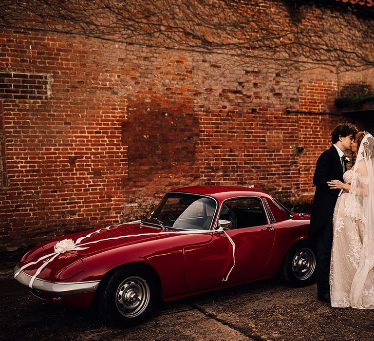 Vintage wedding car for bride at groom at Oxnead Hall venue in Norfolk