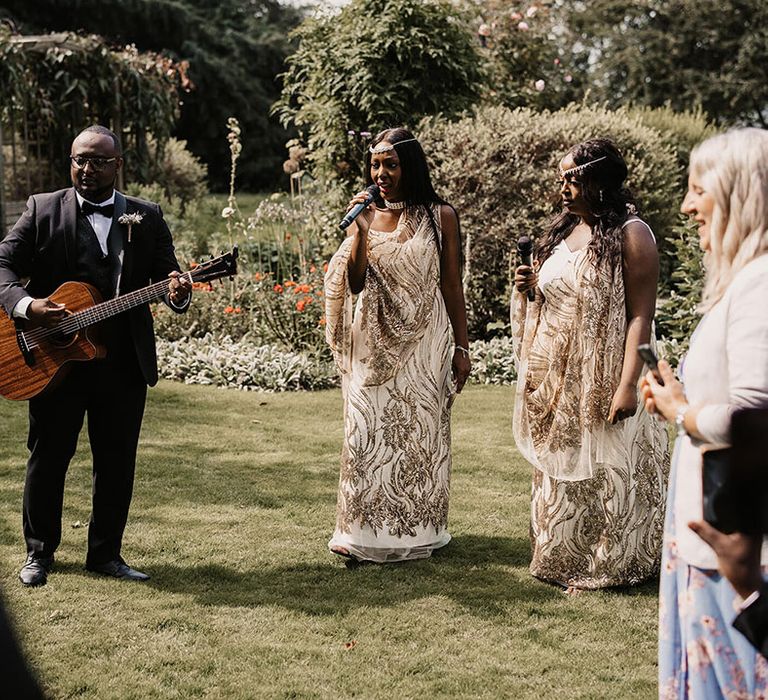 Musician plays guitar on wedding day outdoors