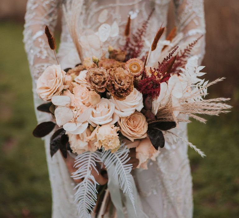 Orange, white, red, black wedding bouquet with neutral and warm tones