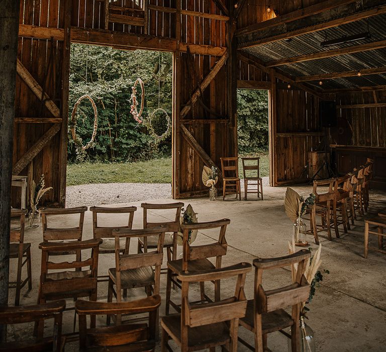 Hula hoop decor decorates the altar at Nancarrow Farm for the rustic barn wedding venue 