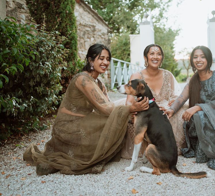 South Asian Bride and bridesmaids with pet dog at Domaine de Blanche Fleur, Provence wedding