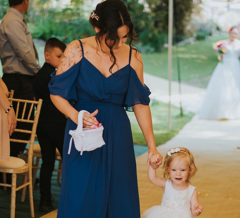 Navy blue bridesmaid dress and white flower girl dress with tutu skirt 