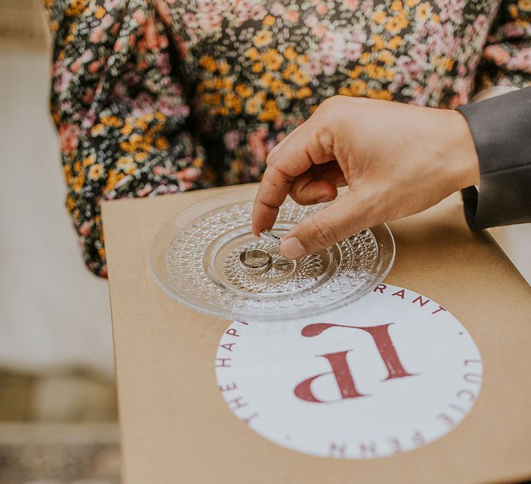 wedding rings on a glass plate 